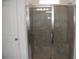 Bathroom shower with clear glass door and tiled walls at 245 Brunswick Dr, Davenport, FL 33837