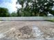 Large, private backyard area enclosed by a white fence and mature trees, offering ample space at 2531 Blue Wave Pl, Oviedo, FL 32765