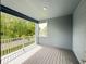Relaxing balcony with wood-style flooring and views of the green backyard at 2531 Blue Wave Pl, Oviedo, FL 32765