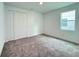 Comfortable bedroom with carpeted floors and a double-door closet at 2531 Blue Wave Pl, Oviedo, FL 32765