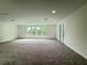 Large bonus room with plush carpet and access to a balcony at 2531 Blue Wave Pl, Oviedo, FL 32765