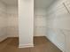 Walk-in closet features an open shelving system for optimal organization at 2531 Blue Wave Pl, Oviedo, FL 32765