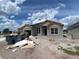New construction home with a modern design, showcasing large windows and a spacious two-car garage at 2643 Ravencliffe, Oviedo, FL 32765