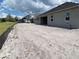 Newly constructed home exterior with a covered patio, showcasing a modern design and spacious outdoor living at 2643 Ravencliffe, Oviedo, FL 32765