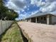 Spacious backyard view with a block-wall home, featuring framed window openings and a blank-slate lot at 2644 Ravencliffe Ter, Oviedo, FL 32765