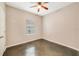 A bedroom showcasing a ceiling fan and a window to allow natural light at 2792 Whispering Trails Dr, Winter Haven, FL 33884
