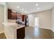 Well-lit kitchen with stainless steel appliances and a breakfast bar at 2792 Whispering Trails Dr, Winter Haven, FL 33884