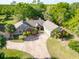 Aerial view of the home showcasing the paved driveway and lush surroundings at 2836 S Stewart St, Kissimmee, FL 34746