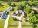 Aerial view of the property showcasing the long paved driveway and landscaping at 2836 S Stewart St, Kissimmee, FL 34746