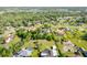 Aerial view of the property showcasing lush landscaping and nearby homes at 2836 S Stewart St, Kissimmee, FL 34746