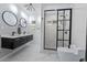 Contemporary bathroom featuring a double vanity, walk-in shower, and modern fixtures at 2836 S Stewart St, Kissimmee, FL 34746