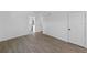 Bright, airy bedroom features wood floors, neutral walls, and easy access to other rooms in the home at 2836 S Stewart St, Kissimmee, FL 34746