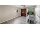 Bright bedroom with hardwood floors, two windows, and a closet at 2836 S Stewart St, Kissimmee, FL 34746