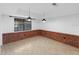 Bonus room with ceramic tile flooring, brick accents, and large window at 2836 S Stewart St, Kissimmee, FL 34746