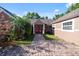 Inviting front entrance with a red door, brick pathway, and well-maintained landscaping at 2836 S Stewart St, Kissimmee, FL 34746
