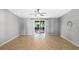 Spacious living room features tile floors and sliding doors to the lanai at 2836 S Stewart St, Kissimmee, FL 34746