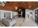 Inviting living room with wood ceiling, fireplace, and tiled floors at 2836 S Stewart St, Kissimmee, FL 34746