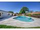Picture of a well-maintained in-ground pool and travertine patio in backyard at 3029 Peel Ave, Orlando, FL 32806