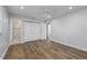 Bedroom featuring wood floors, a ceiling fan, and a large closet space at 3029 Peel Ave, Orlando, FL 32806