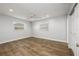 Bedroom featuring wood floors, ceiling fan, and windows that bring in natural light at 3029 Peel Ave, Orlando, FL 32806