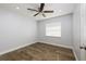 Bright bedroom featuring wood floors, a ceiling fan, a window, and fresh paint at 3029 Peel Ave, Orlando, FL 32806