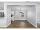 Bright dining room with wood floors and access to kitchen, ideal for Gathering meals at 3029 Peel Ave, Orlando, FL 32806