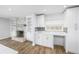 Cozy kitchenette adjacent to living room with custom cabinetry, granite counters, fireplace and built-in shelving at 3029 Peel Ave, Orlando, FL 32806