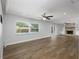 Spacious living room with wood floors and modern fireplace, perfect for entertaining at 3029 Peel Ave, Orlando, FL 32806