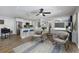 Open concept living area with modern kitchen, comfortable seating, and stylish decor at 3029 Peel Ave, Orlando, FL 32806