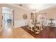 Cozy dining room with elegant decor and a view of the open floor plan at 310 Stakes Ct, Deland, FL 32724