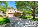 Charming two-story home featuring a well-maintained lawn and a two-car garage at 310 Stakes Ct, Deland, FL 32724