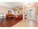 Inviting living room featuring hardwood floors, natural light, and a cozy seating arrangement at 310 Stakes Ct, Deland, FL 32724