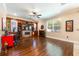 Spacious living room with a fireplace, custom built ins, and hardwood floors at 310 Stakes Ct, Deland, FL 32724