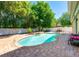 Backyard pool with brick pavers, enclosed by a white fence and lush landscaping at 310 Stakes Ct, Deland, FL 32724