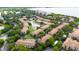 Aerial view of community featuring lush landscaping, serene ponds, and well-maintained buildings at 3542 Shallot Dr # 108, Orlando, FL 32835
