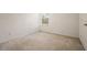 Cozy bedroom featuring neutral carpet and a large window at 3542 Shallot Dr # 108, Orlando, FL 32835