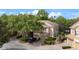 A two-story townhouse with a tile roof features a two-car garage and mature landscaping at 3542 Shallot Dr # 108, Orlando, FL 32835
