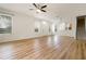 Sunlit living room with open floor plan showcases wood floors and natural light at 3542 Shallot Dr # 108, Orlando, FL 32835