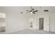 Spacious bedroom showcasing vaulted ceilings, ceiling fan, and a view of the bathroom through an open doorway at 3542 Shallot Dr # 108, Orlando, FL 32835