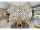 Cozy breakfast nook with chandelier lighting and multiple windows for natural light at 392 Bayberry Dr, Polk City, FL 33868