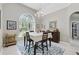 Well lit dining room with decorative chandelier and table set for four at 392 Bayberry Dr, Polk City, FL 33868