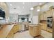 Spacious kitchen featuring stainless steel appliances and light colored cabinets at 392 Bayberry Dr, Polk City, FL 33868