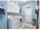 Bright laundry room with large capacity washer and dryer at 392 Bayberry Dr, Polk City, FL 33868