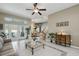 Bright living room with tiled floors, glass doors to the pool, and neutral walls at 392 Bayberry Dr, Polk City, FL 33868