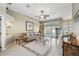 Bright living room featuring tile floors with decorative border and neutral colored walls at 392 Bayberry Dr, Polk City, FL 33868
