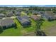 An angled aerial shot features a well-kept home with a screened-in patio, set in a lush, green neighborhood at 4687 Nw 35Th Lane Rd, Ocala, FL 34482