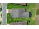 An overhead shot of a property highlighting a well-maintained roof, landscaping, and screened-in patio at 4687 Nw 35Th Lane Rd, Ocala, FL 34482