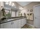 This bathroom features a double sink vanity, neutral walls, tile floors, and great lighting at 4687 Nw 35Th Lane Rd, Ocala, FL 34482