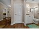 Hallway entrance into bathroom with tiled floors, granite countertop vanity, and tiled glass shower at 4687 Nw 35Th Lane Rd, Ocala, FL 34482