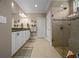 Beautiful bathroom featuring a double sink vanity, a tiled shower, and neutral walls at 4687 Nw 35Th Lane Rd, Ocala, FL 34482